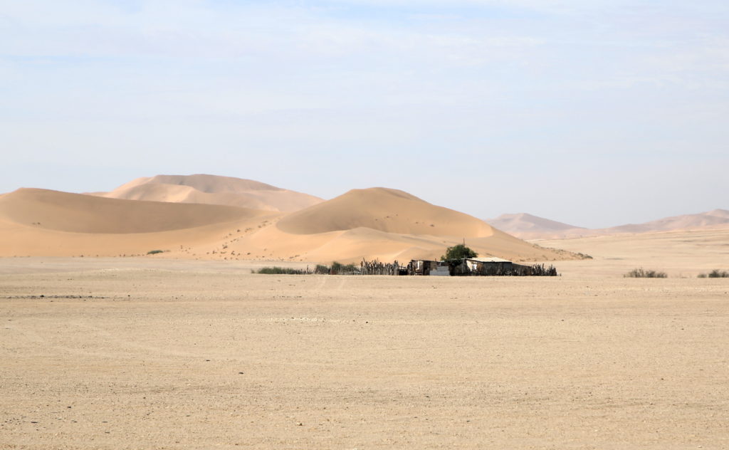 Sand Dunes in the background of a house in the Kuiseb river