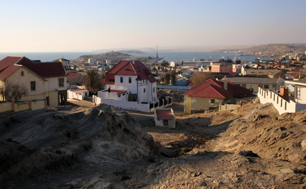 Houses and the harbor of Luderitz carved out of the rock